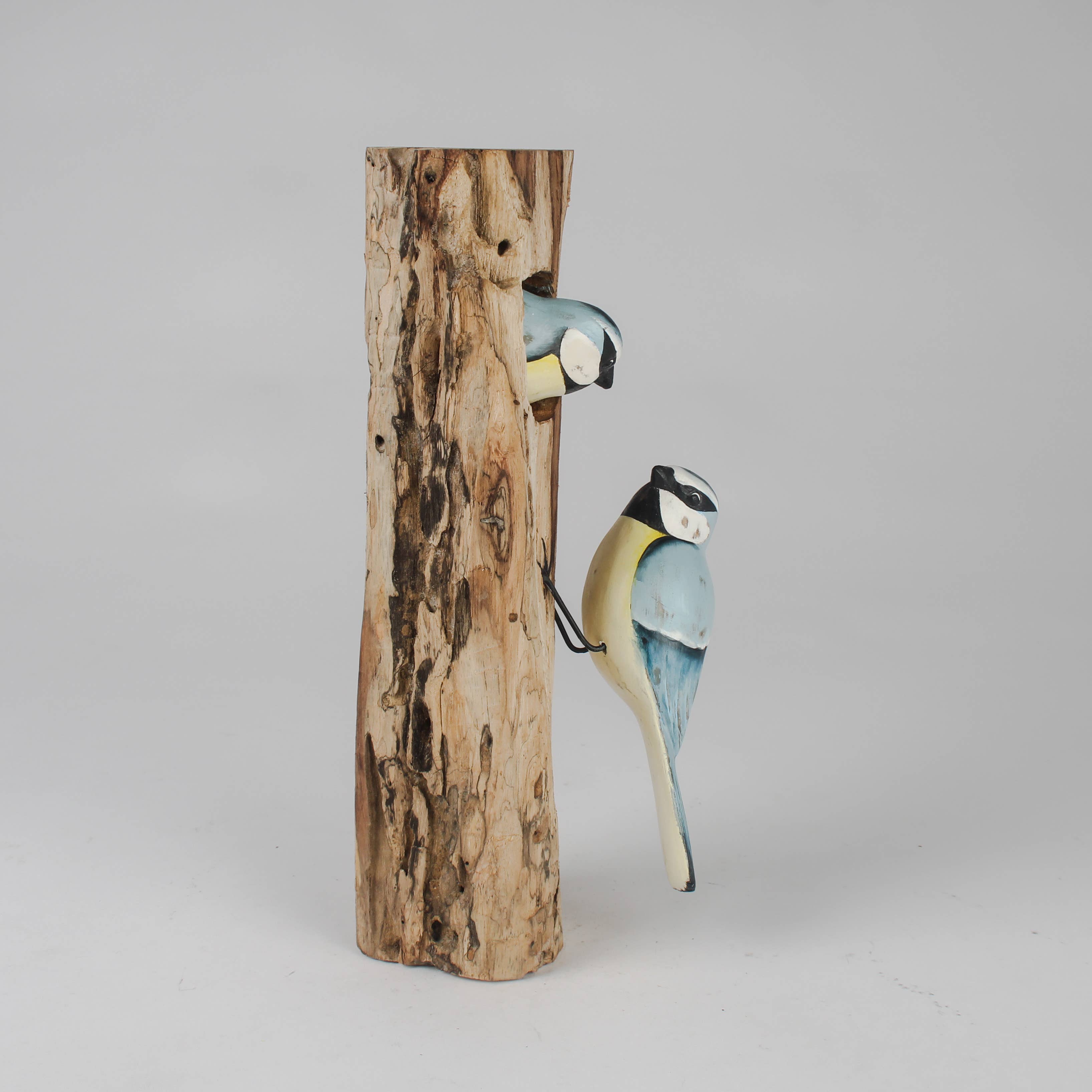 Hand Carved Blue Tit Family on Tree Stump by Archipelago