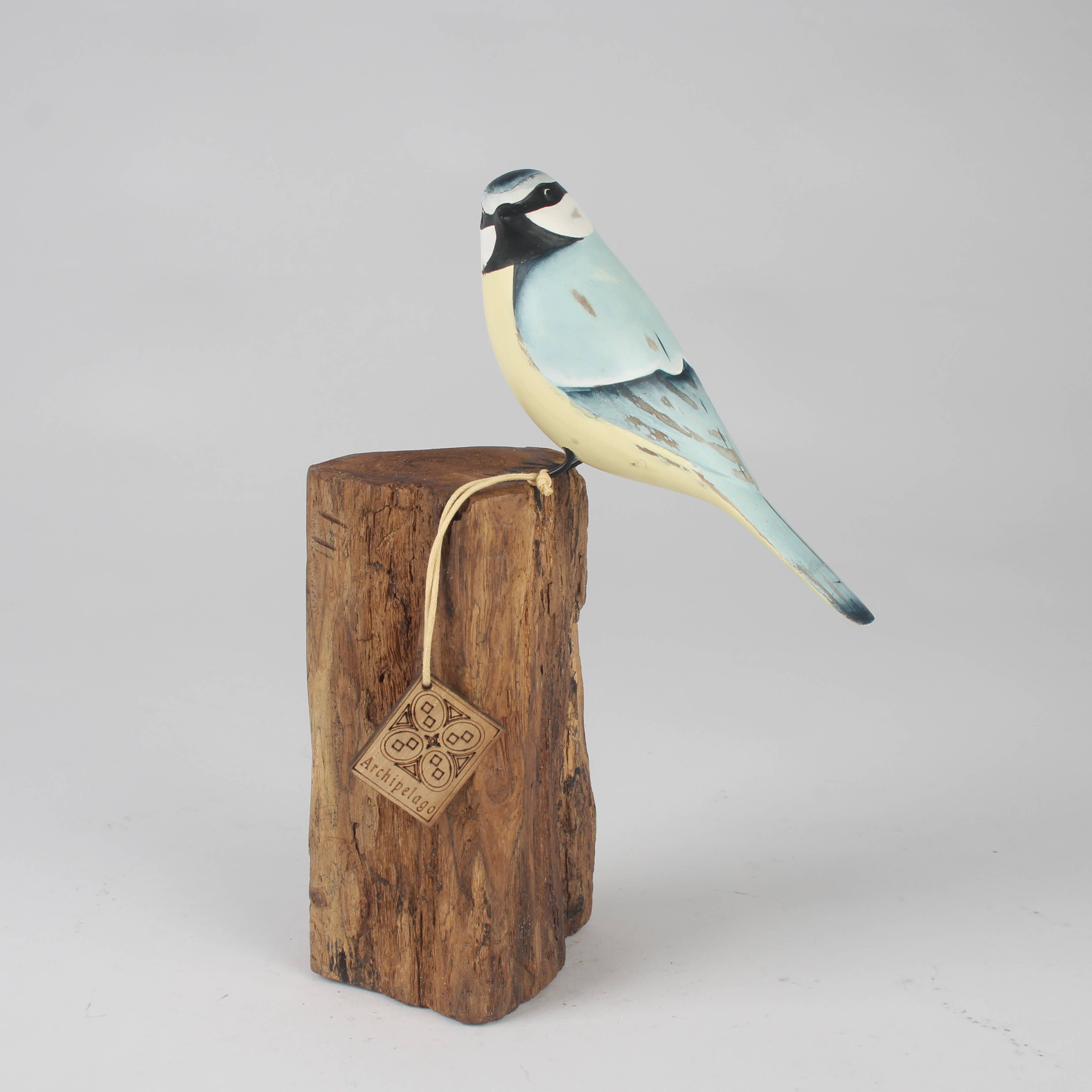 Hand Carved Blue Tit on Tree Stump by Archipelago
