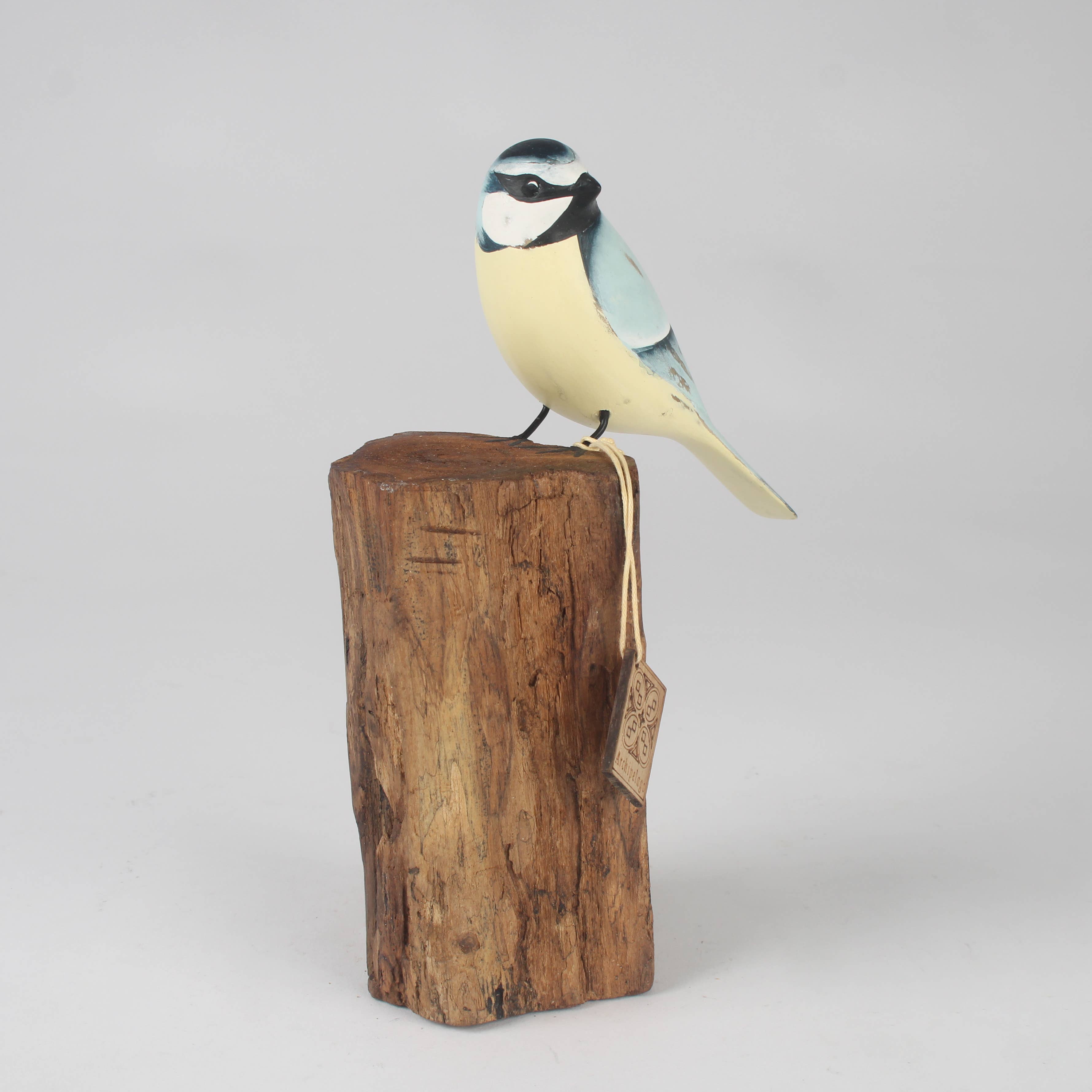 Hand Carved Blue Tit on Tree Stump by Archipelago