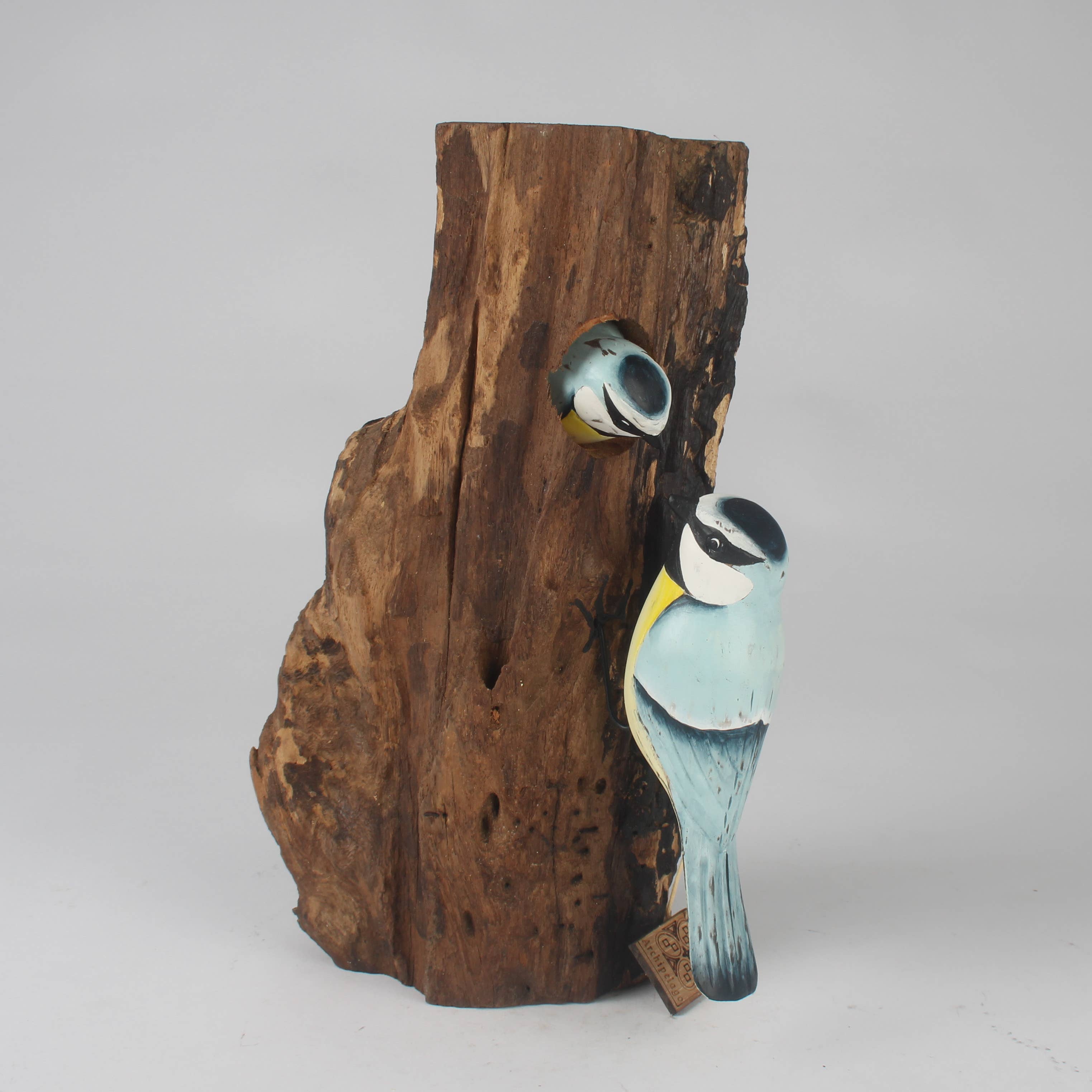 Hand Carved Blue Tit Family on Tree Stump by Archipelago